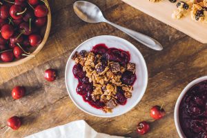 VANILLA NONFAT YOGURT WITH DARK CHOCOLATE CHUNK GRANOLA AND WARM CHERRY COMPOTE