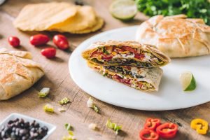 BLACK BEAN CRUNCHWRAP WITH VEGGIES AND SOUR CREAM